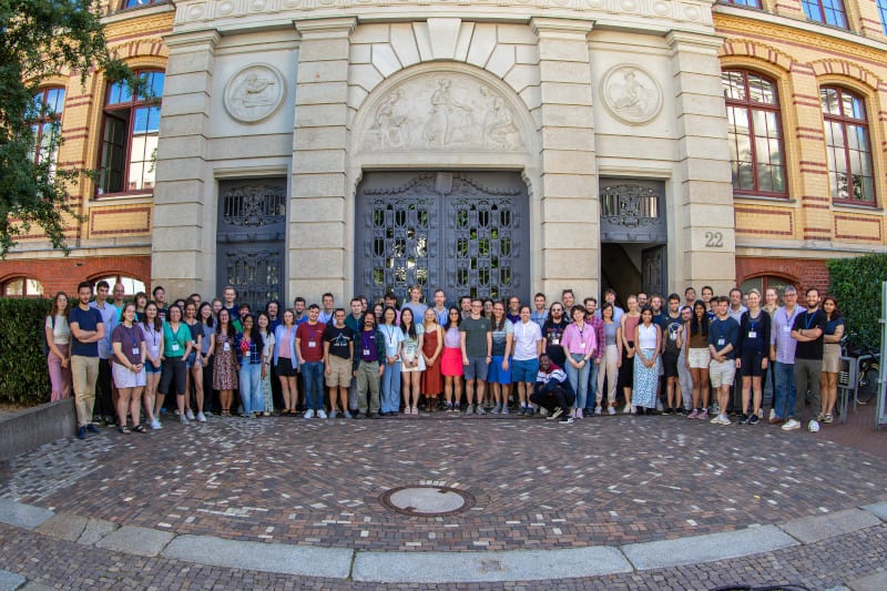 Discriminants summer school participants gathered in front of the institute entrance in Leipzig